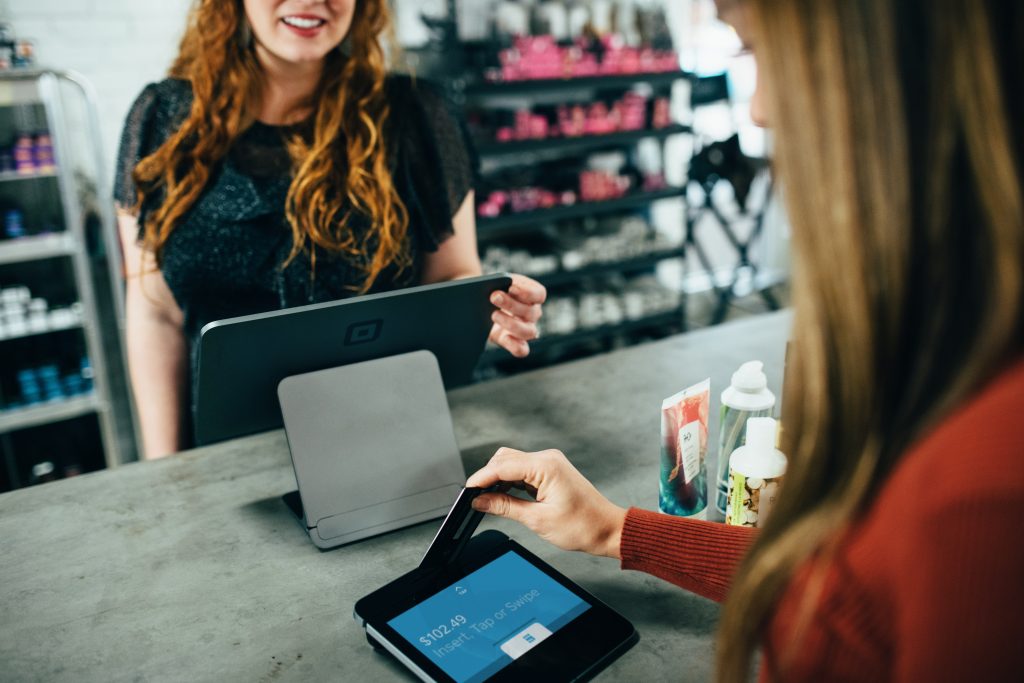 woman paying using credit card