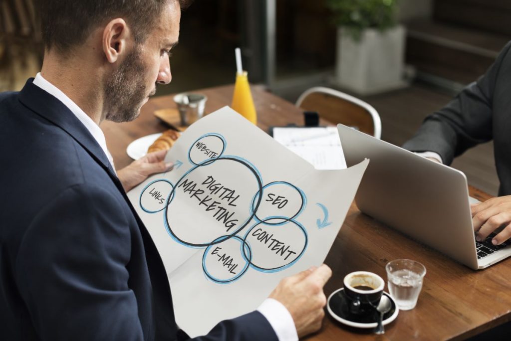 man looking at marketing plan