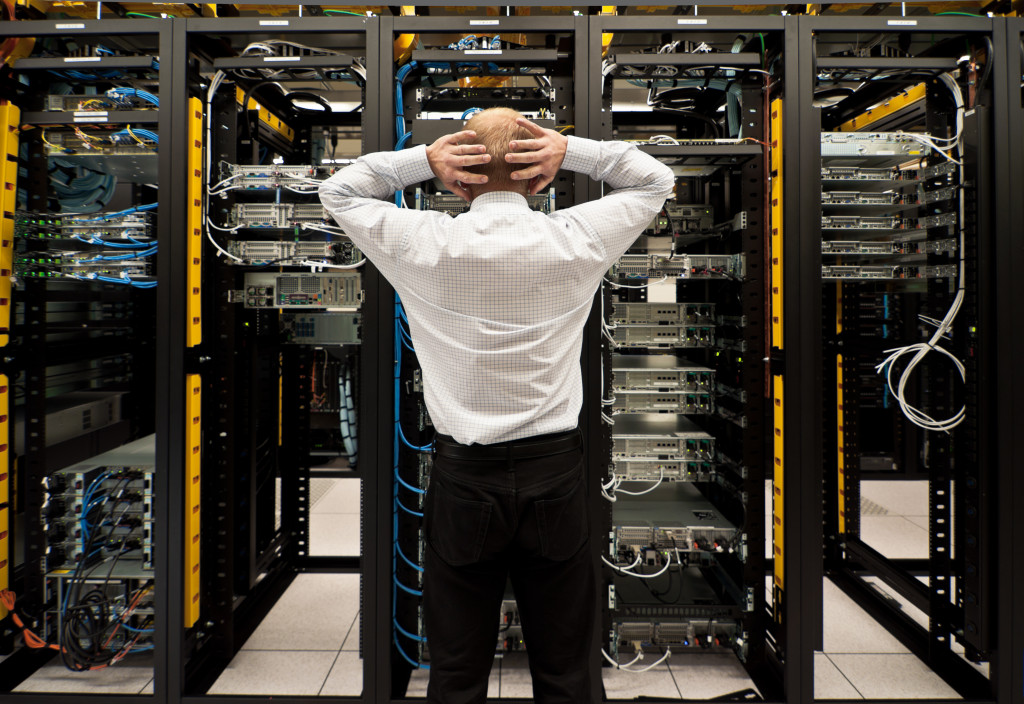 man in a network data center