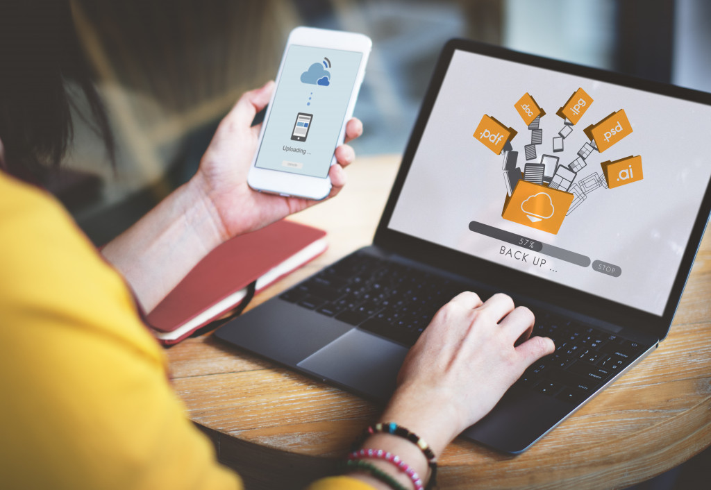 backing up files to the cloud using smartphone and laptop