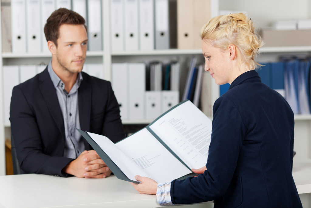 Young male candidate wearing suit in a job interview 