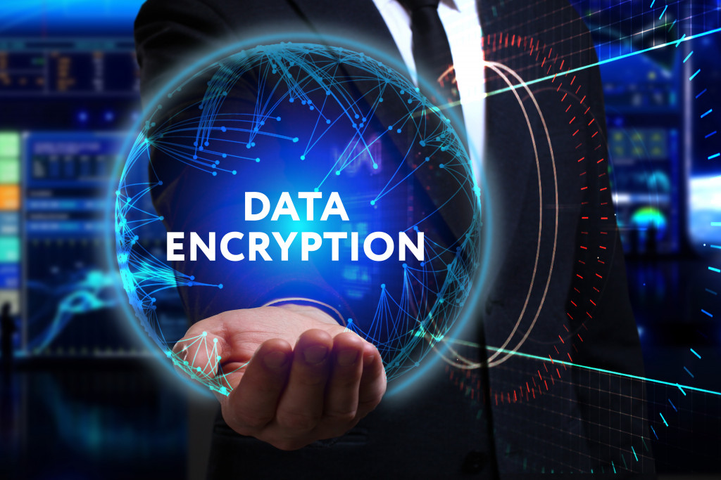 man in a suit holding data encryption concept